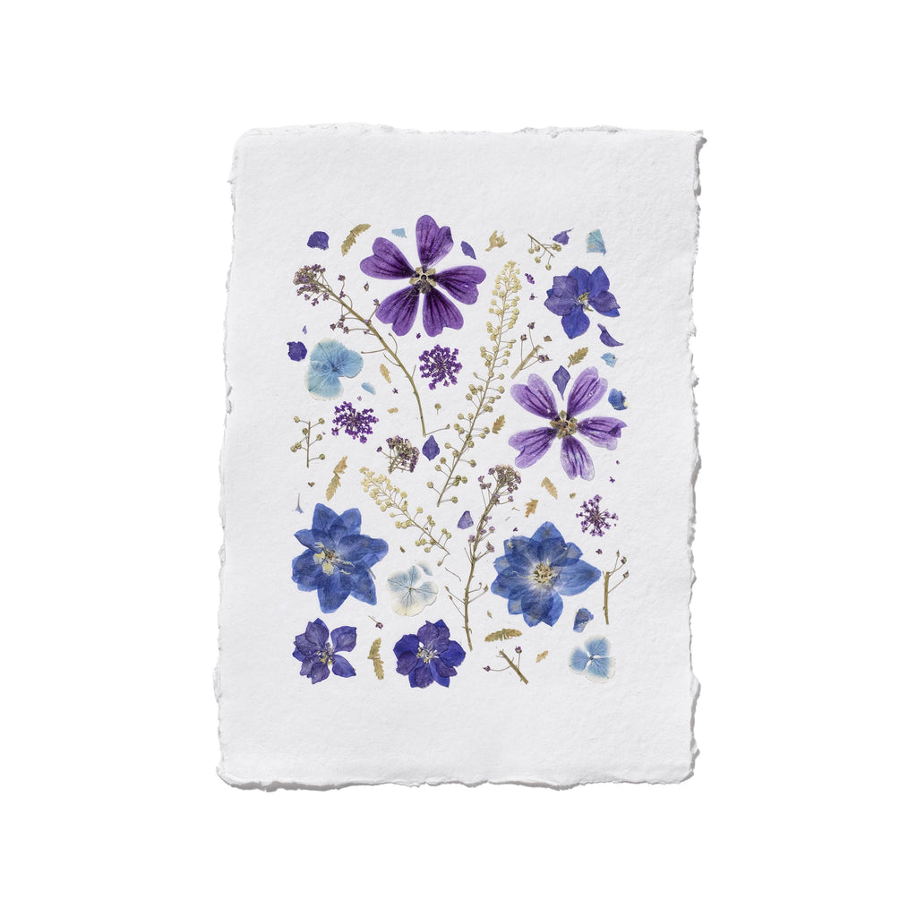 A square white paper art print with a rustic, slightly rough edge, featuring a delicate floral design of purple and blue flowers with green stems on a white background.