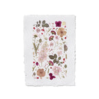 A square white fabric paper, featuring botanical flowers and leaves in pink, burgundy, beige, and olive green.